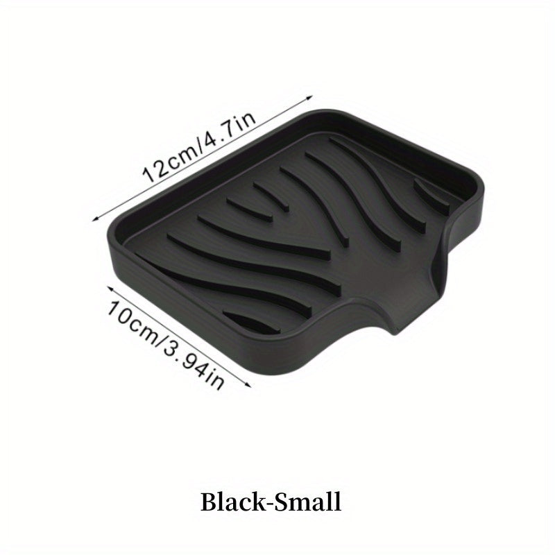 Silicone soap dish with self-draining design for countertop or sink storage in bathroom.