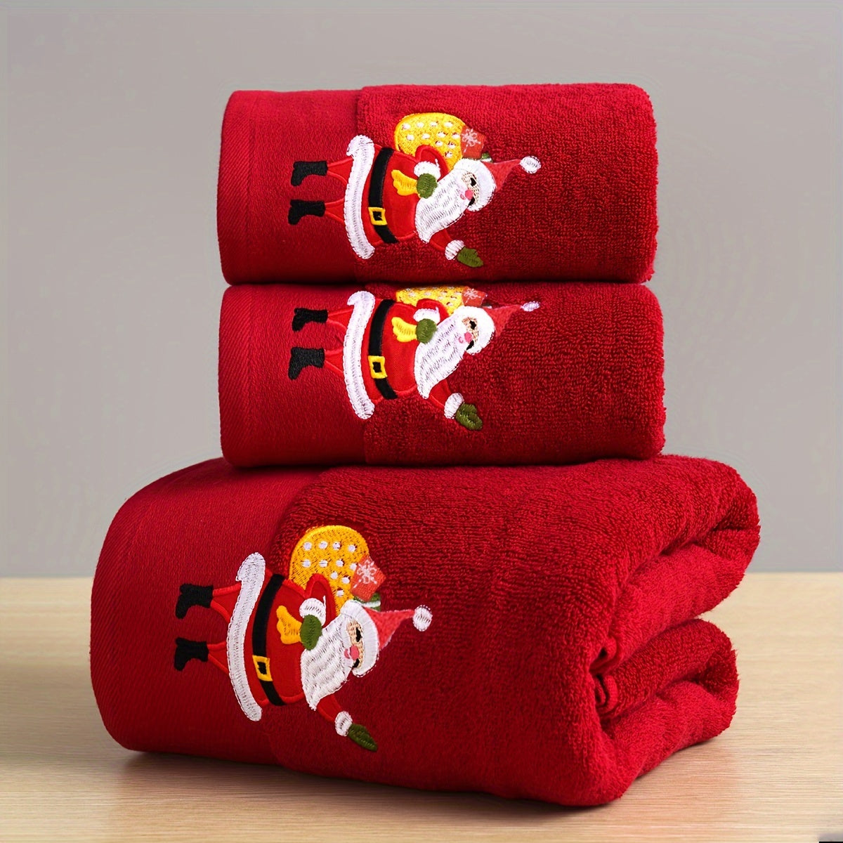 Christmas-themed towel set with embroidered snowman design. Includes 2 towels and 1 bath towel, ideal for couples' bathroom essentials and holiday gifts. Made of 100% cotton.