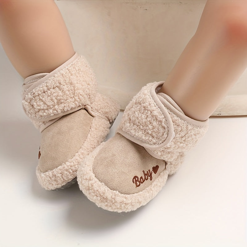 Cozy boots for baby boys and girls, featuring hook and loop fasteners for indoor and outdoor winter walks.