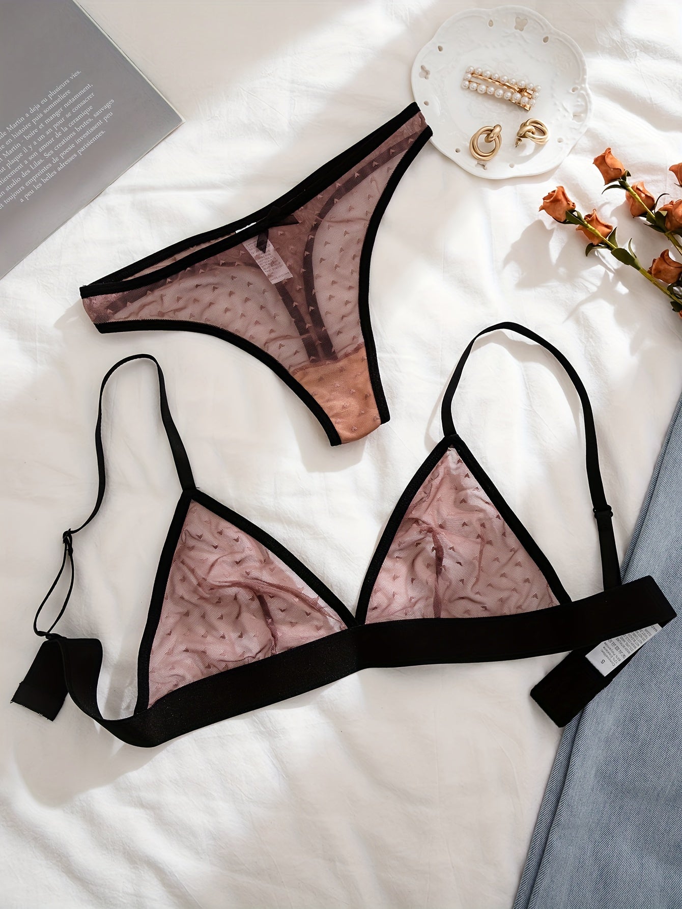 Seductive lingerie set with push-up bra and thong in semi-sheer mesh fabric.