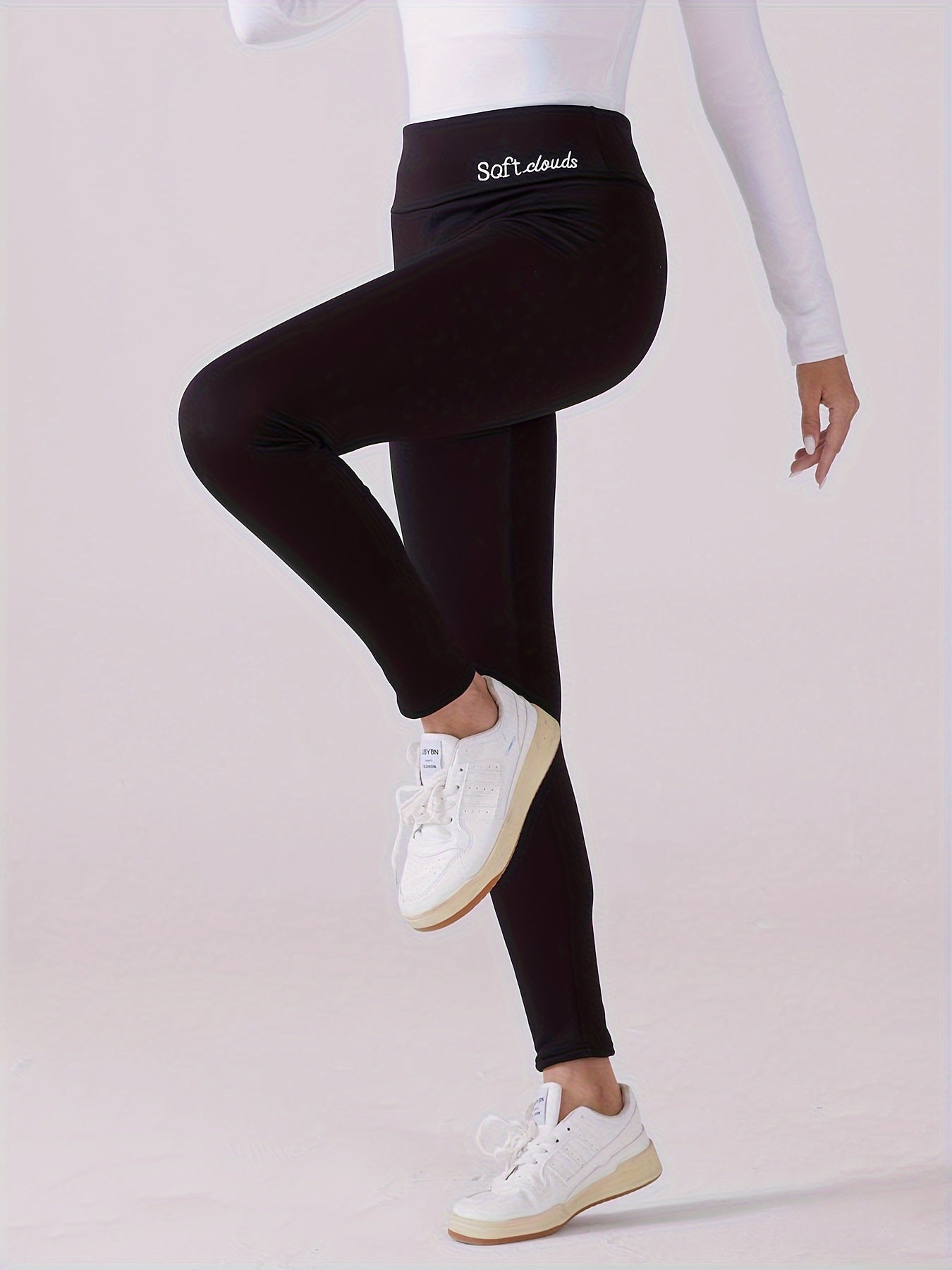 Cozy high-waist leggings with fleece lining, embroidery, and stretchy polyester blend for elegant autumn and winter comfort, machine washable.