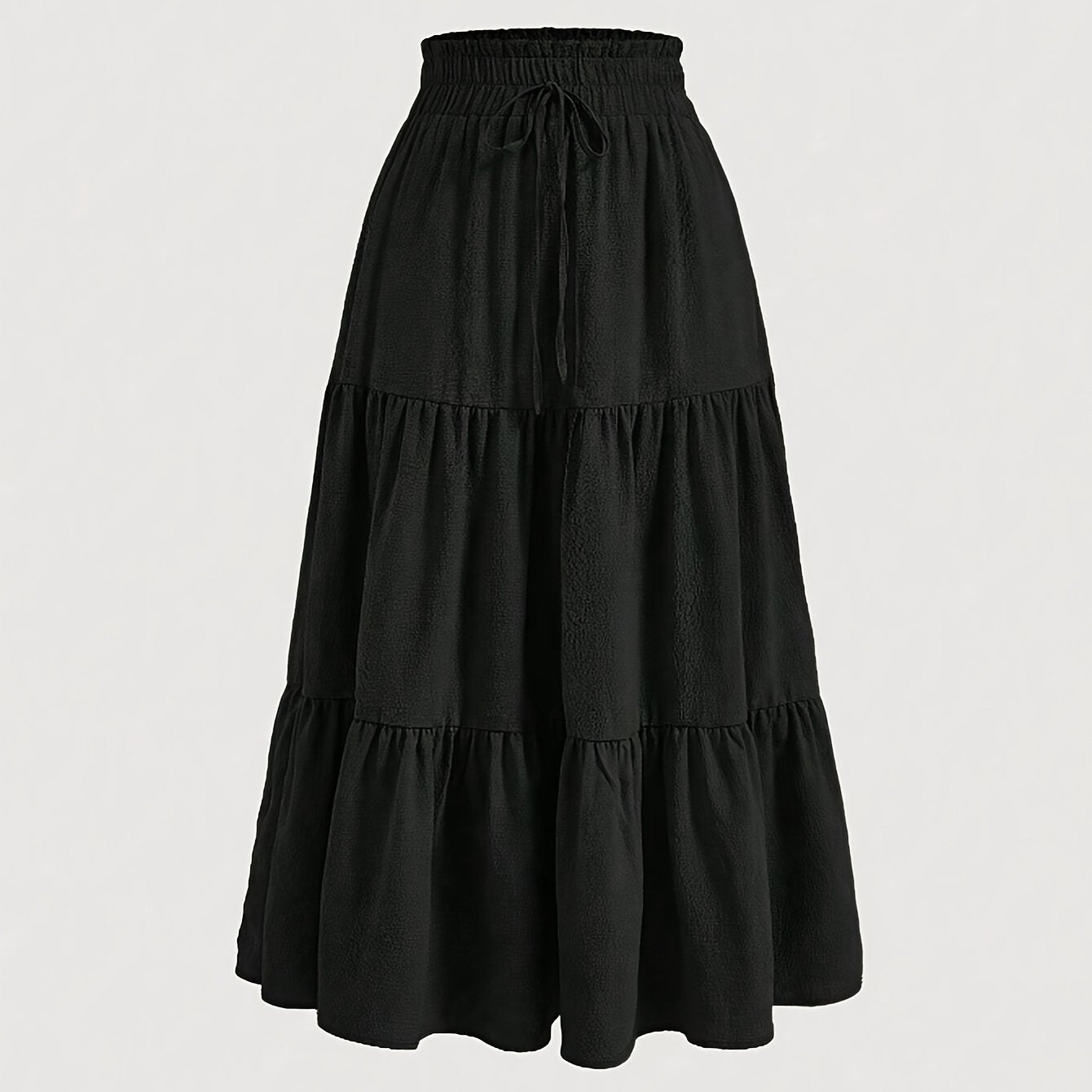 High-waisted maxi skirt with ruffled hem, made of polyester blend, perfect for casual wear in spring, summer, and autumn, machine washable.