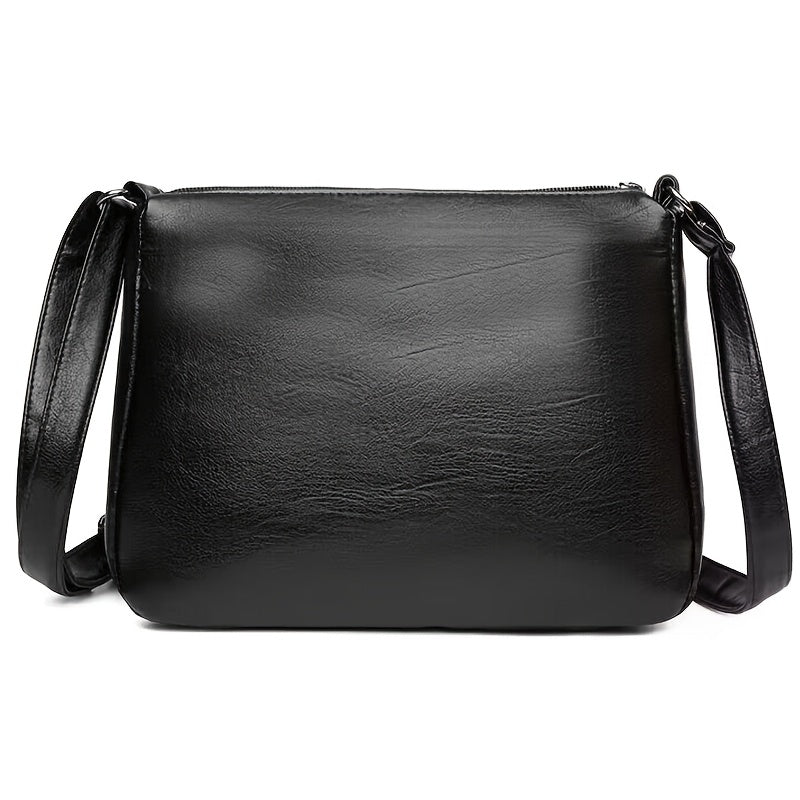 Women's black casual crossbody bag with adjustable strap, ideal for outings, durable and small