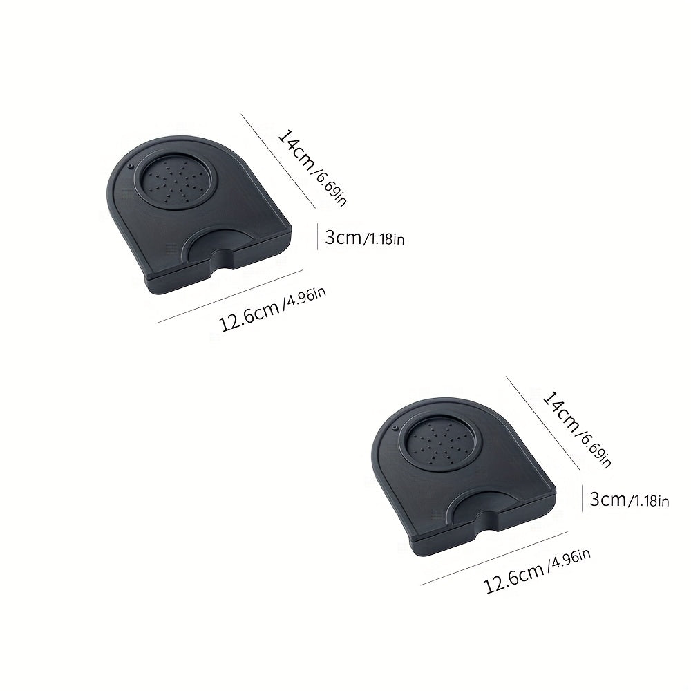 A set of two small and convenient Silicone Coffee Tamper Mats that are non-stick, food grade, easy to clean, durable, and heat resistant. These mats are the perfect espresso coffee distributor accessory for baristas and coffee lovers alike.