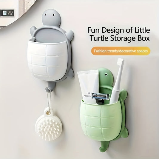 Turtle-shaped wall-mounted remote control holder with self-adhesive storage for home bathroom makeup organization.