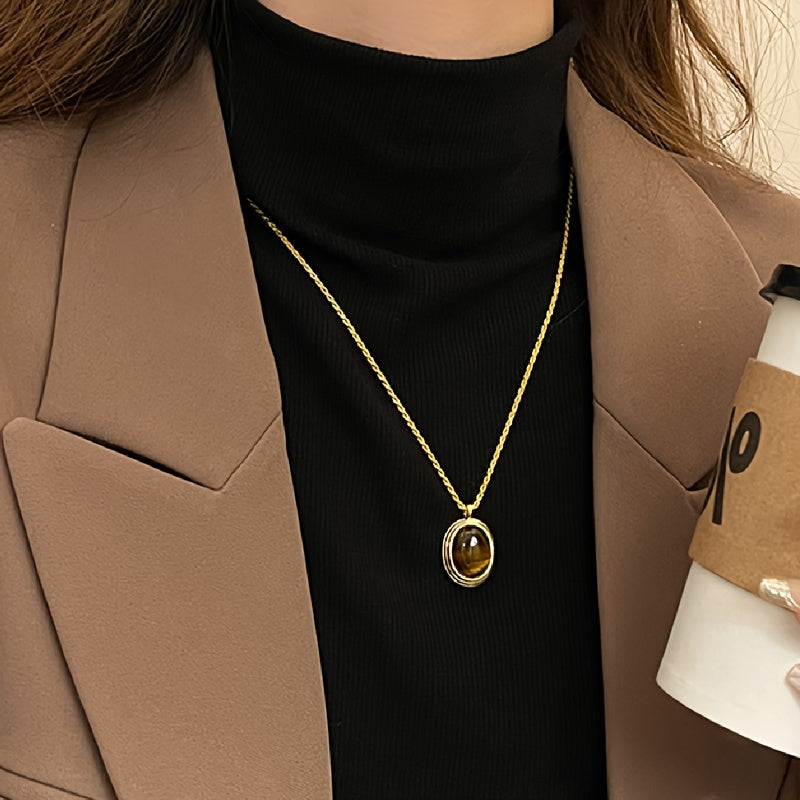 Stylish bohemian oval pendant necklace featuring Tiger Eye stone in a vintage design - Crafted from 18K gold plated titanium steel with a natural stone mosaic. Perfect for daily wear or as a special gift.