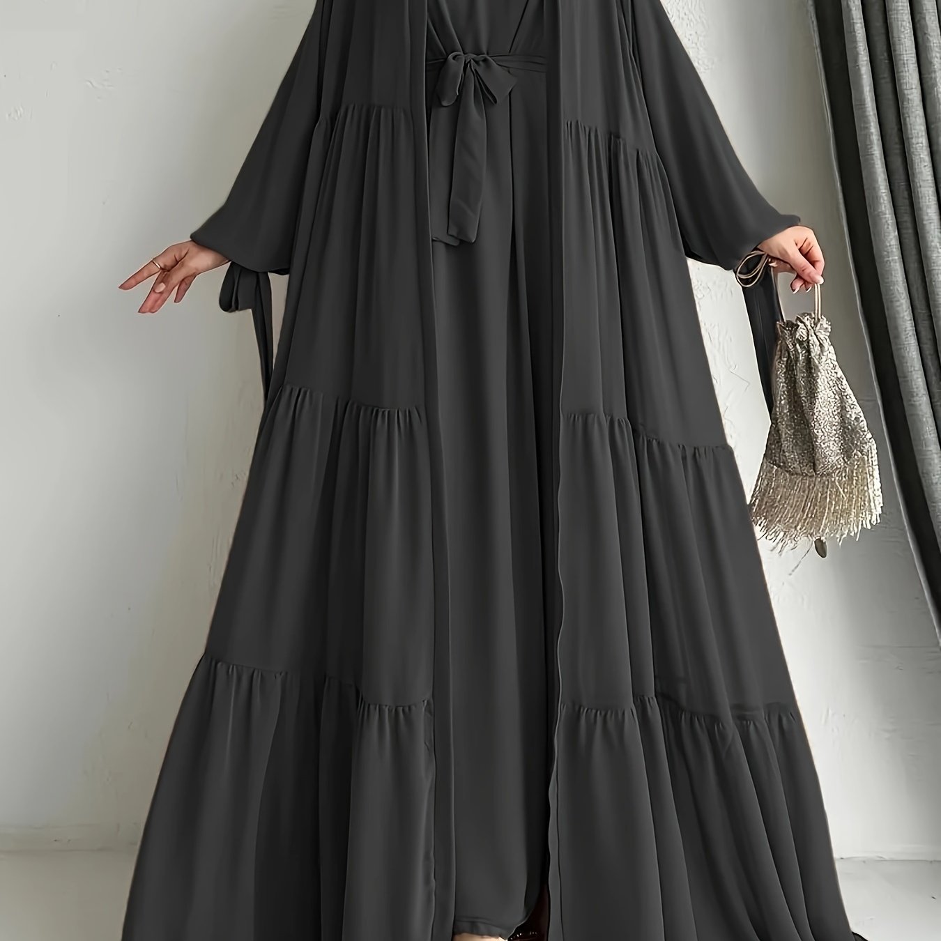 A stylish Middle Eastern Abaya set with vest and belt, featuring a chiffon H-Line robe with side split, lantern sleeves, and ruffle hem detail - perfect for all seasons.