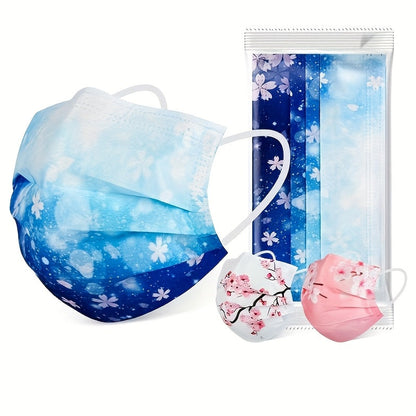 Pack of 50 Romantic floral and starry sky printed face masks designed for women. These masks are made with 3 layers of woven polypropylene and have elastic, breathable, and sun-protective qualities. They are disposable and come with wide ear loops for a