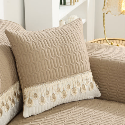 Luxurious Feather Embroidery Quilted Sofa Cover enhances and protects your couch.