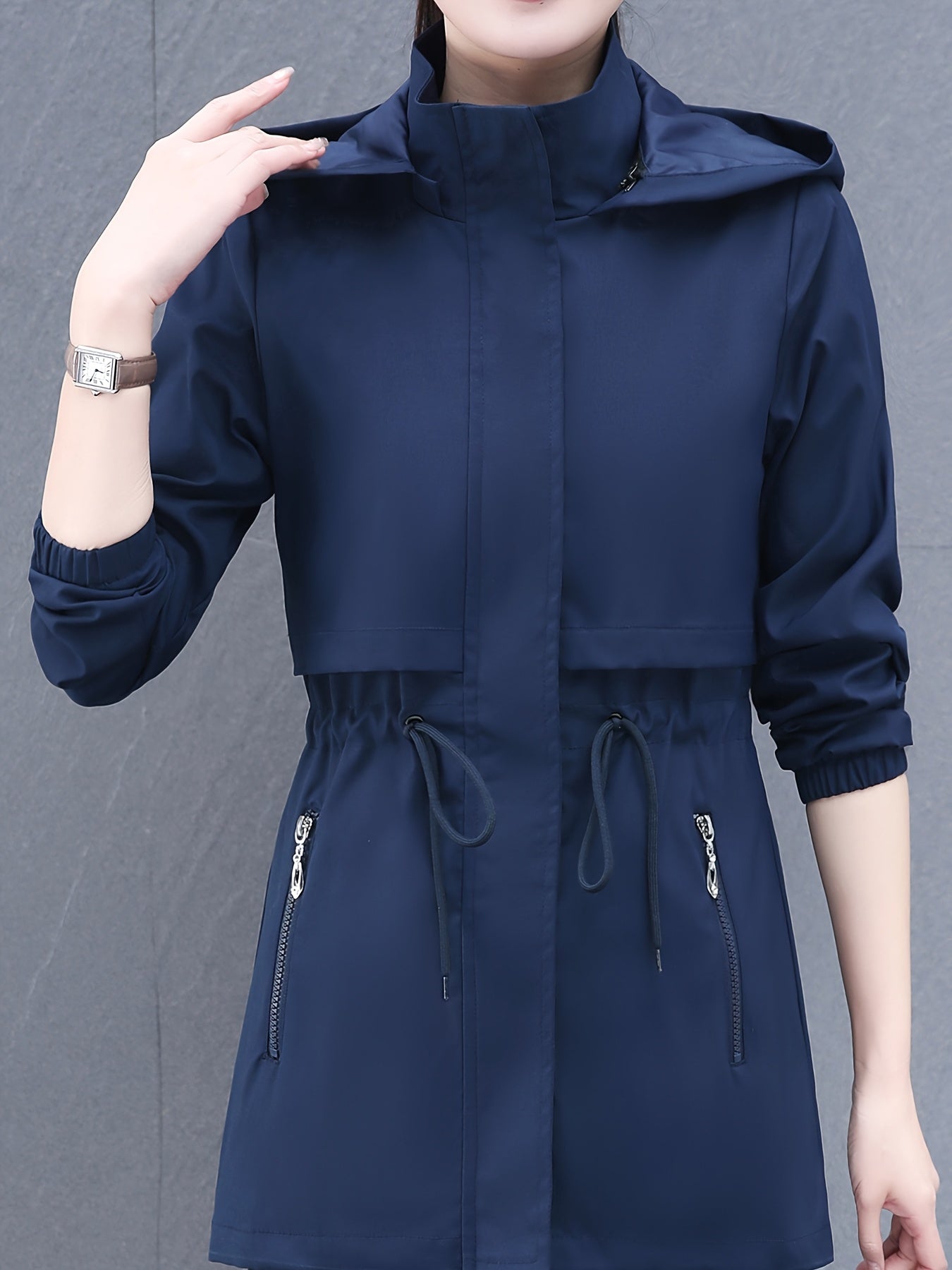 Zip-up windbreaker hoodie jacket with drawstring waist, slant pockets, suitable for spring and fall. Women's casual clothing.