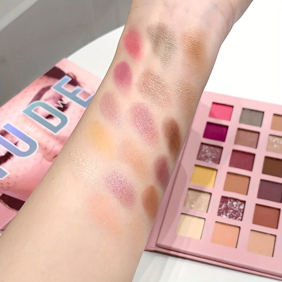 18-Color Desert Rose Eyeshadow Palette with various finishes for festivals, parties, and music events.