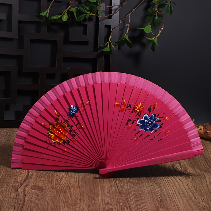 Wooden Spanish folding fan for dancing and home decoration with printed design, conveniently folds for easy storage.