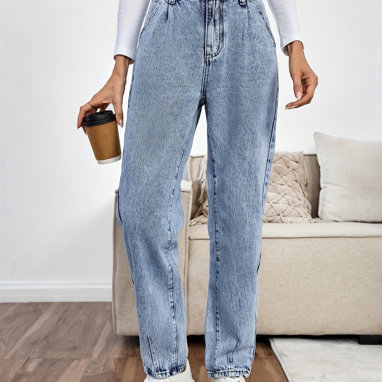 Women's light blue high-waisted straight-leg denim jeans with slash pockets, button closure, and non-stretch cotton material for casual spring/fall wear.