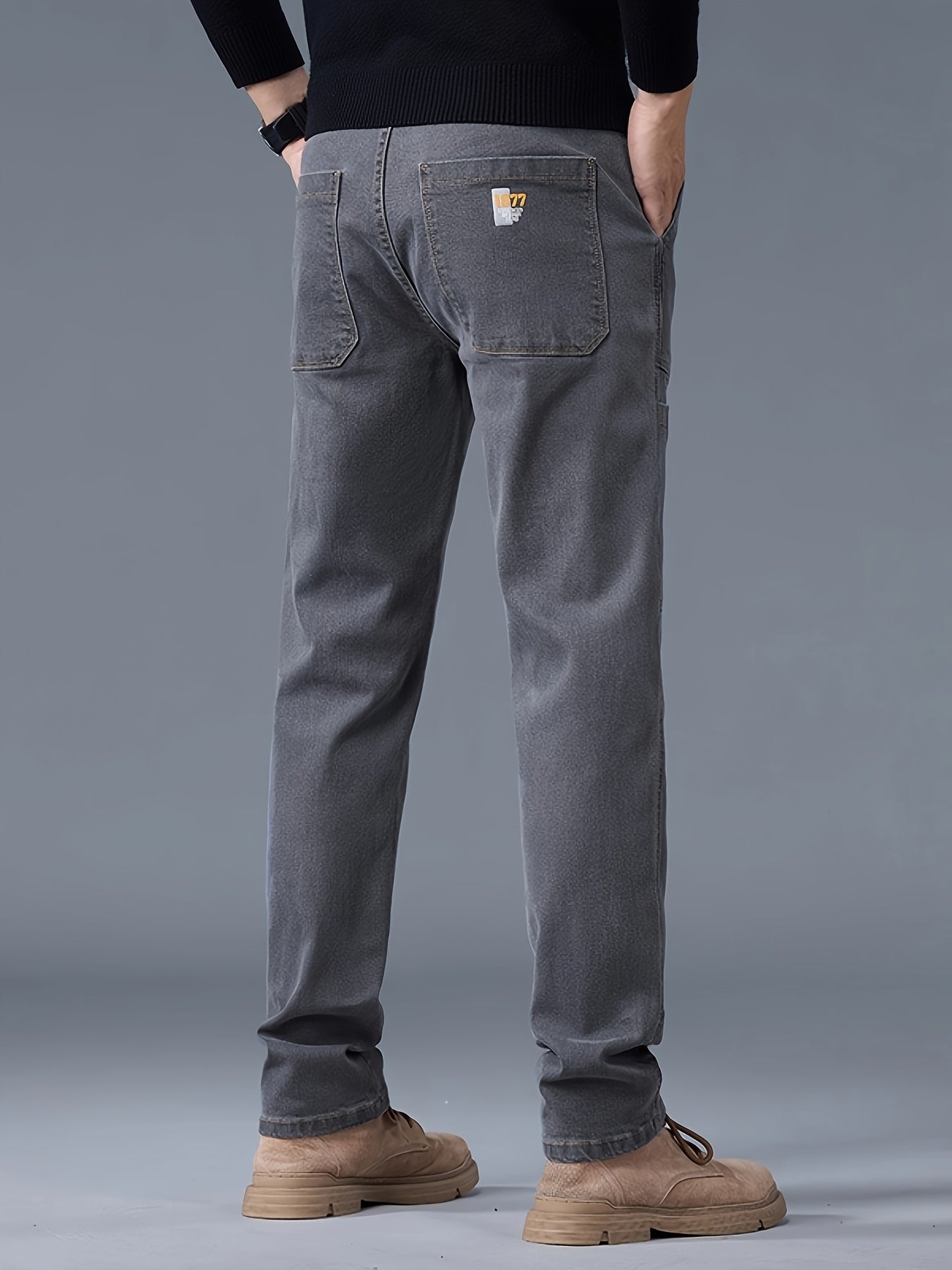 Men's fashion denim jeans made of 70% cotton, 28% polyester, and 1.3% elastane. Features a regular fit, mid waist, zipper fly, and all-season wear. Constructed with 300g/m² woven fabric