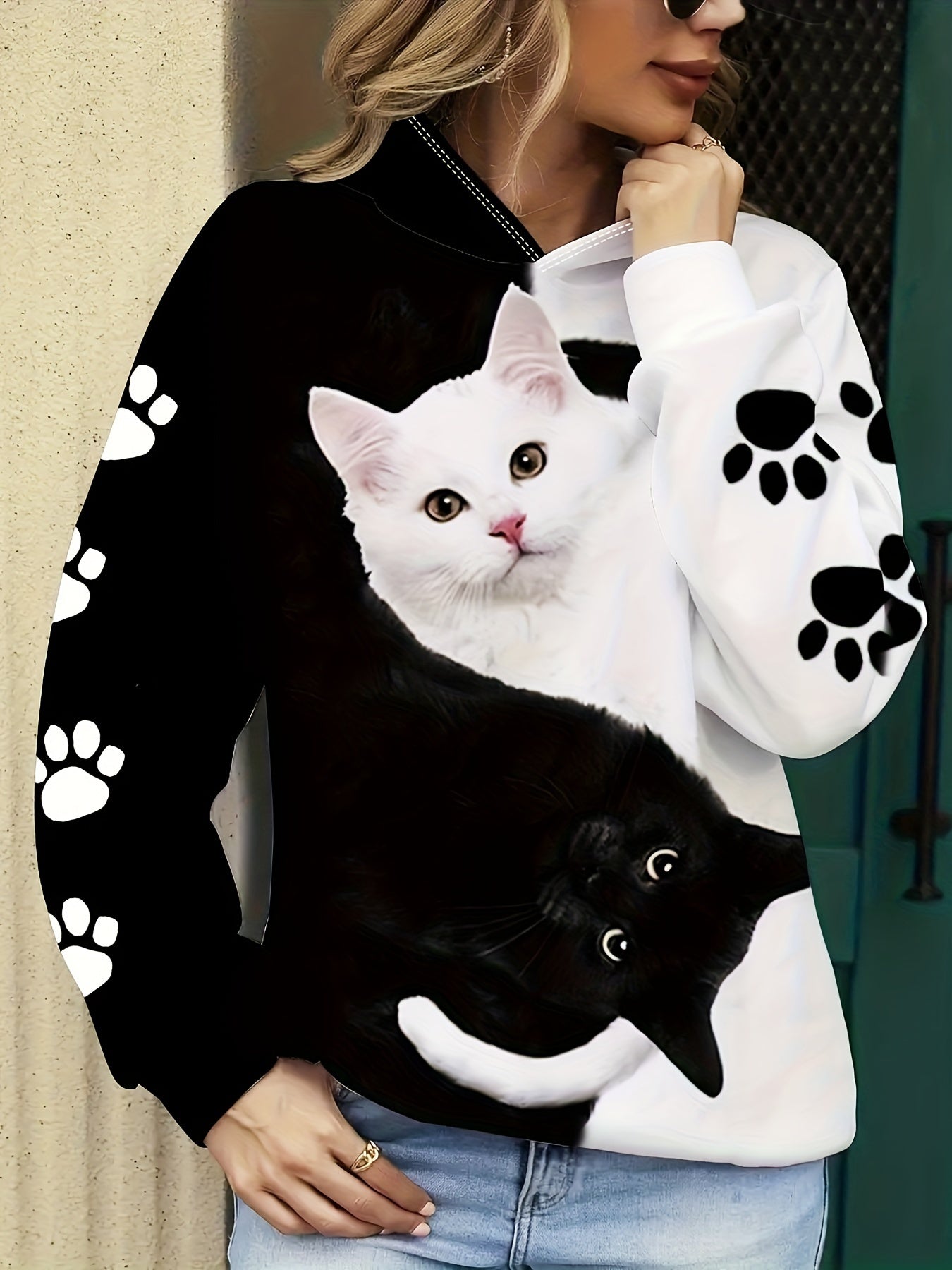 Cozy cat print hoodie for women, with kangaroo pocket, made of machine washable polyester blend.