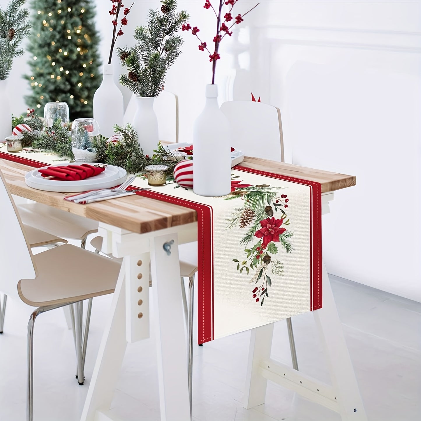 Christmas table runner with red poinsettia and pine branches, available in various sizes for indoor or outdoor home parties.