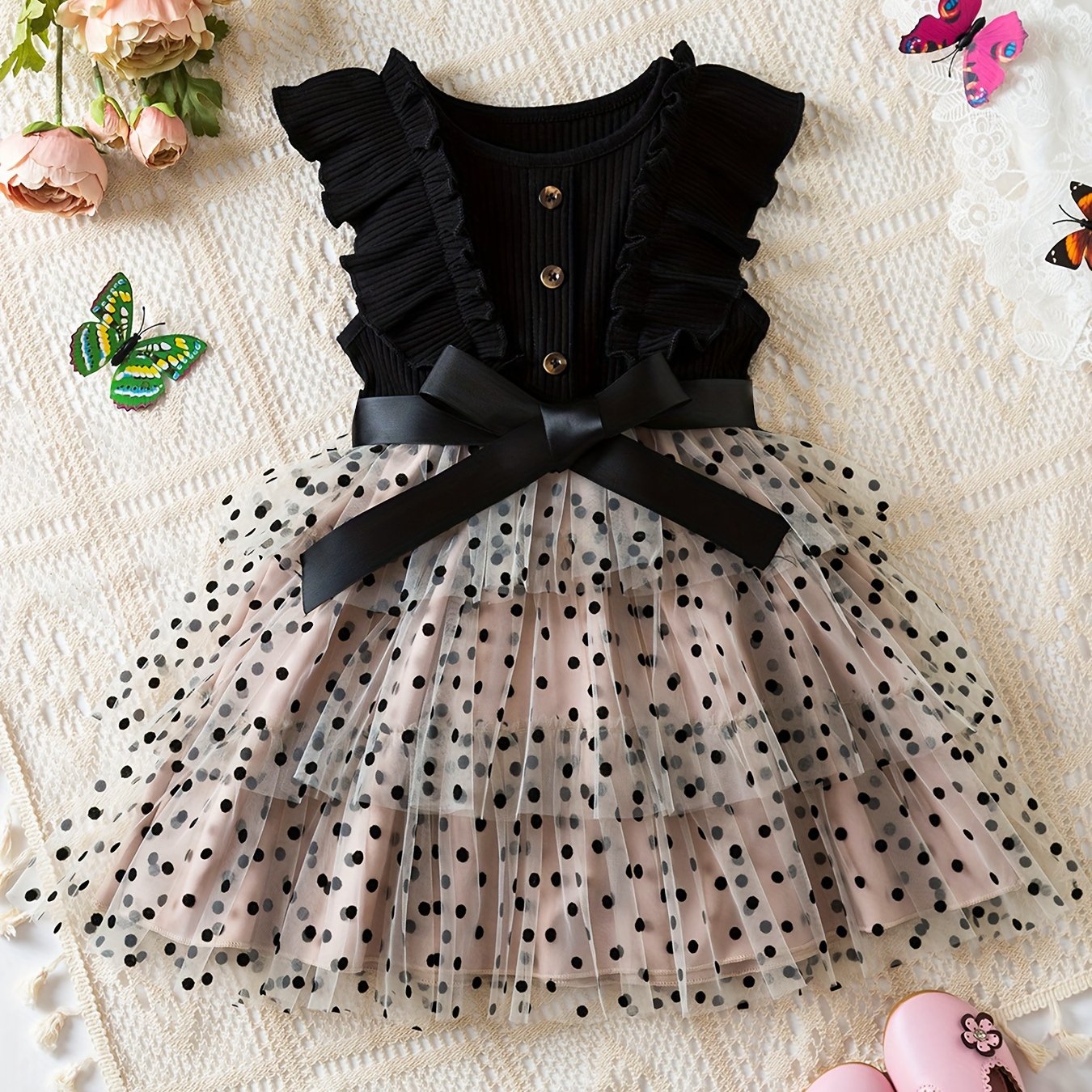 Elegant polka dot print tutu dress with button design for summer parties.