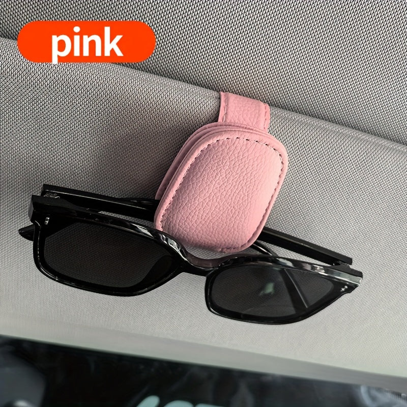 Universal car sun visor clip made of PVC material for storing eyeglasses in the vehicle interior.