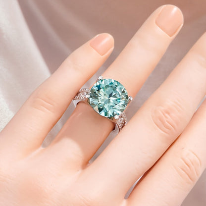 This stunning 10CT Teal Moissanite Engagement Ring features a sparkling 925 silver band, making it the ideal choice for weddings, parties, and as a December birthstone gift.