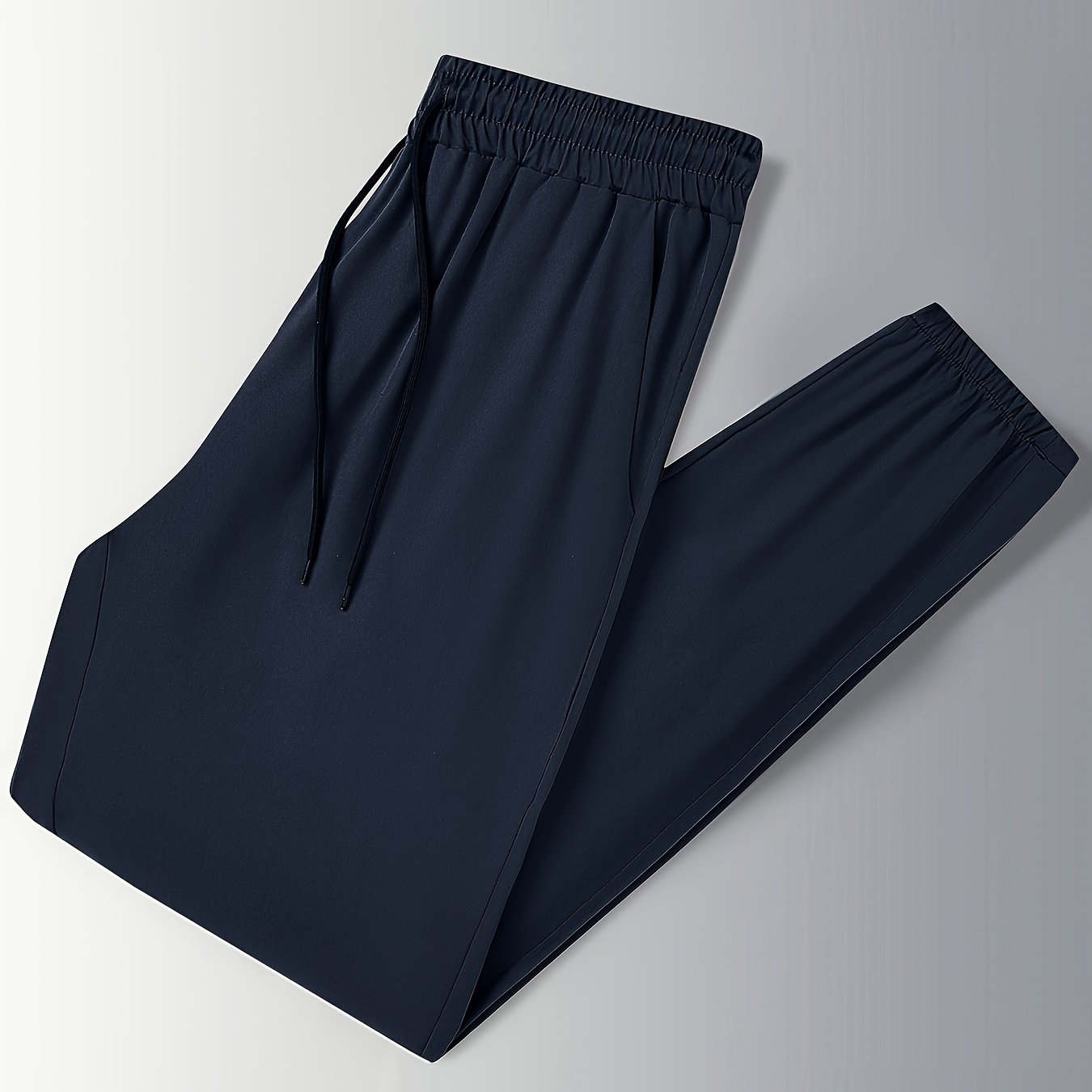 Men's drawstring trousers with pockets for outdoor activities in spring and summer.