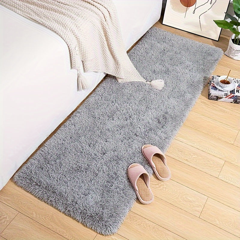 Soft and plush modern shaggy area rug, perfect for adding comfort and style to any indoor space. Made of polyester material, this decorative rug is ideal for living rooms, bedrooms, studies, and lounges. Dry clean only.