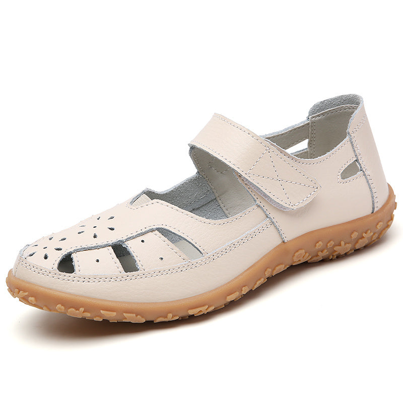 Cut-out flat sandals for women with soft soles and hook & loop closures, ideal for casual walking with their non-slip closed-toe design.