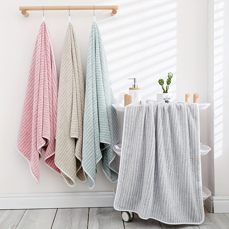 A 140cm*70cm plush bath towel perfect for home, hotel, kitchen, and more. Ultra-absorbent, soft, and gentle on skin.