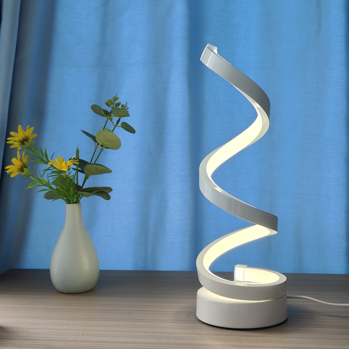 Unique Spiral Table Lamp adds warmth and style to any home.