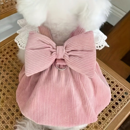 Polyester corduroy dog dress with bow, lace sleeves, and leash ring for small breeds. Suitable for autumn and winter.