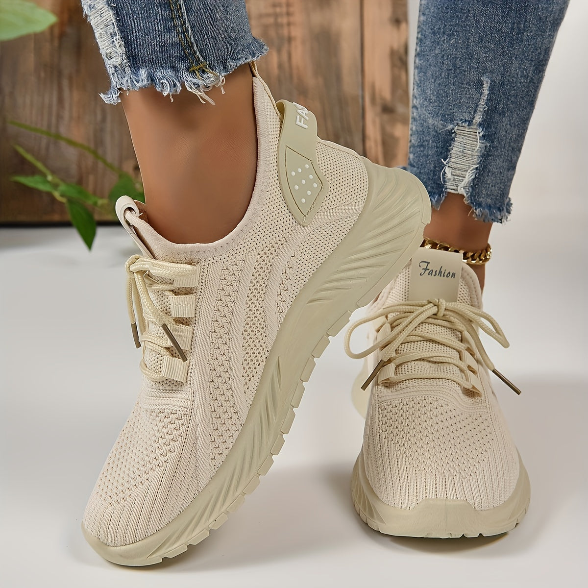 Trendy white knit fabric sneakers for women with EVA sole and breathable lace-up design, suitable for all seasons. Lightweight and stylish.