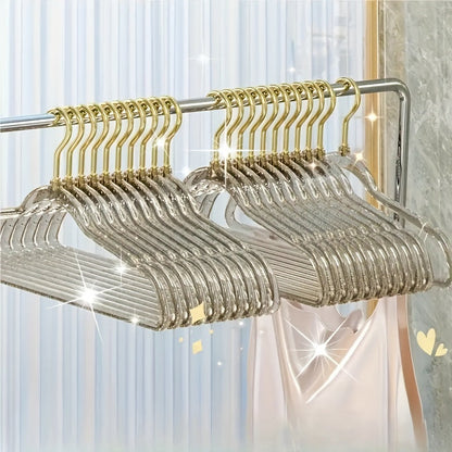 A set of 12 premium acrylic hangers with a non-slip, sparkling transparent design, providing a firm grip for wardrobe storage. These durable, thick hangers are perfect for bedroom closets, offering a traceless hanging solution.