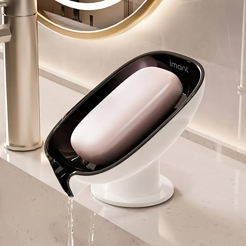 Durable plastic oval soap dish with an elegant, self-draining design for bathroom use.