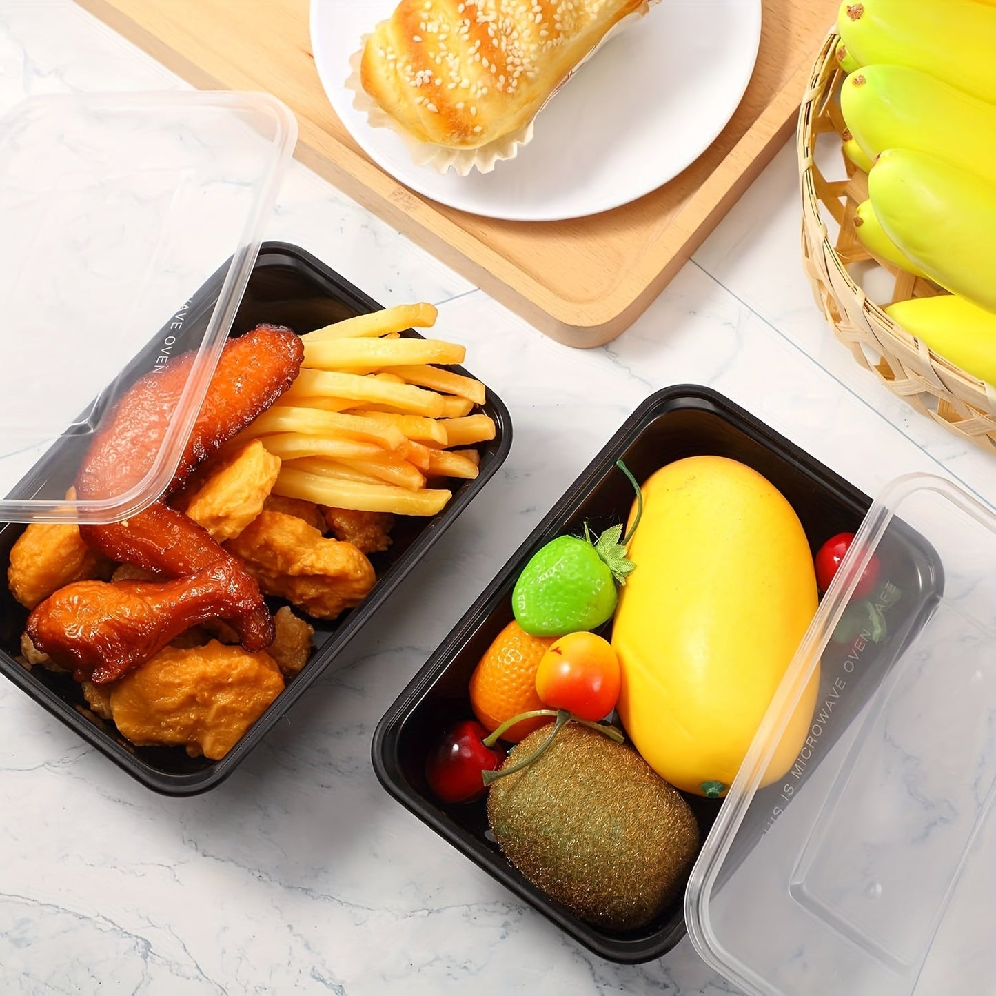 Pack of 30 rectangular plastic black boxes with lids in sizes 17oz, 22oz, and 26oz. These food storage containers are BPA-free, stackable, and leakproof. They are safe to use in the microwave and are perfect for storing and transporting food. Great for