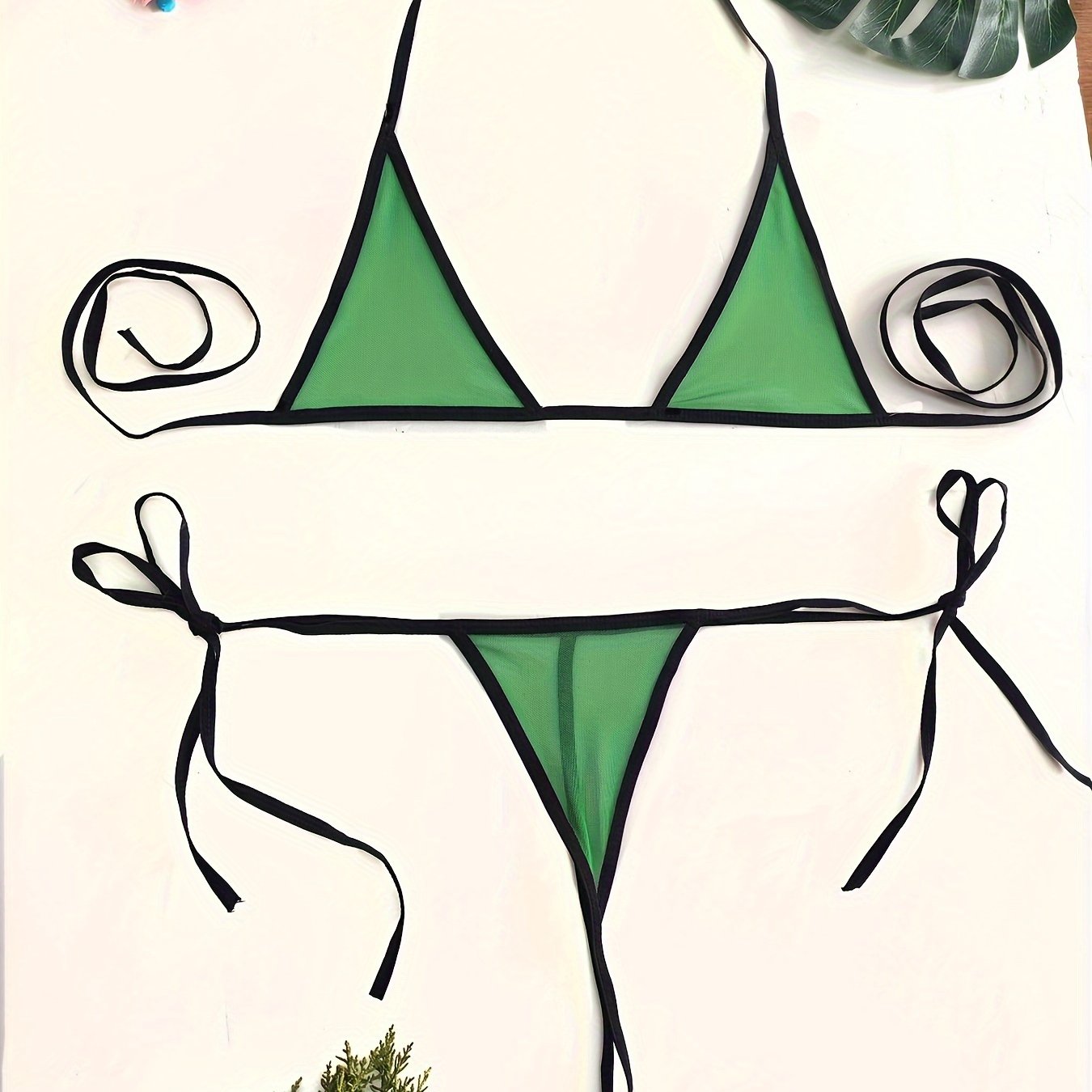 Sexy mesh bikini lingerie set with green triangle contrast trim and adjustable straps for a flattering fit.