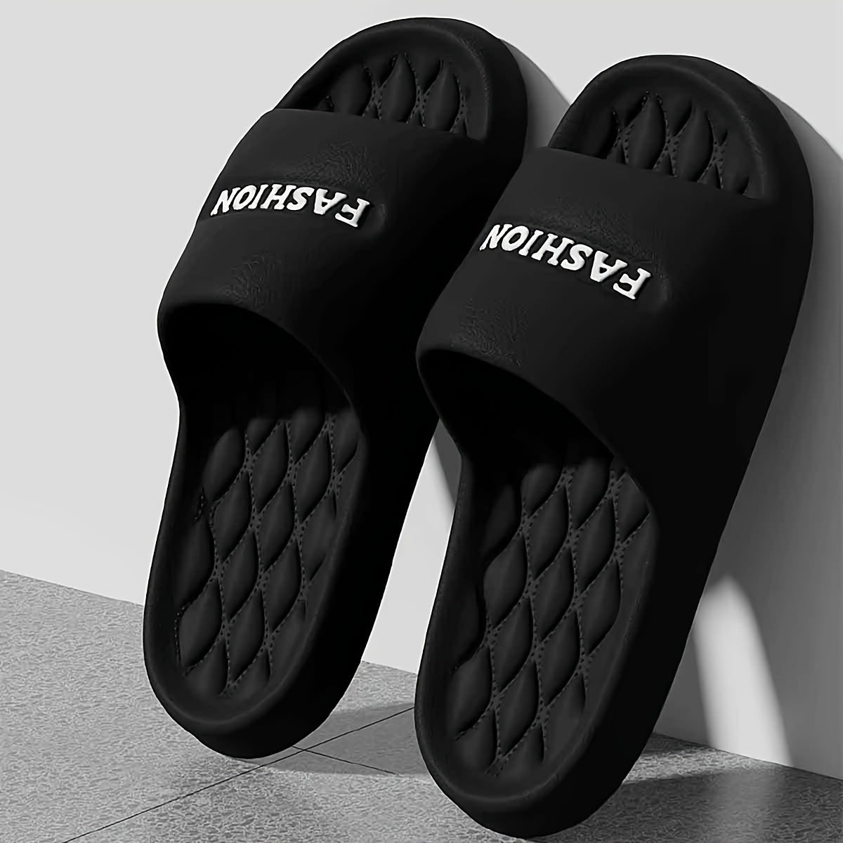 Stylish black EVA slides with thick, non-slip, odor-resistant sole for indoor/outdoor wear.