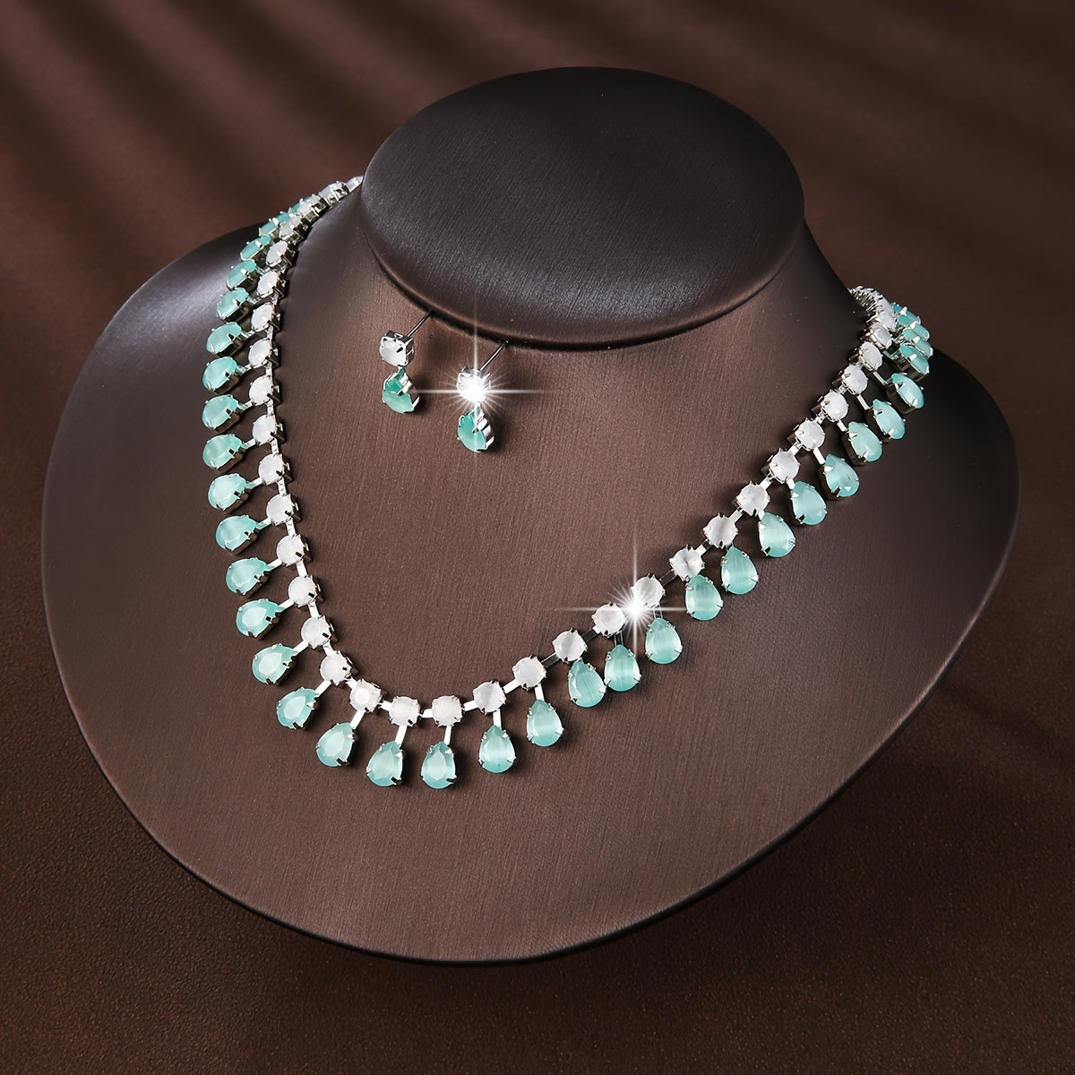 New European and American style set of three elegant jewelry pieces for ladies, including earrings and necklace adorned with luxurious zirconia. Perfect for bridal wedding events or formal banquets, this set is both fashionable and chic.