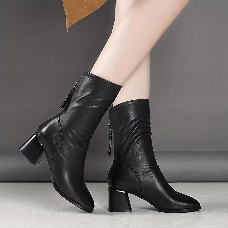 Women's chunky heel boots with back zipper, mid-calf length, and soft sole for casual winter wear.