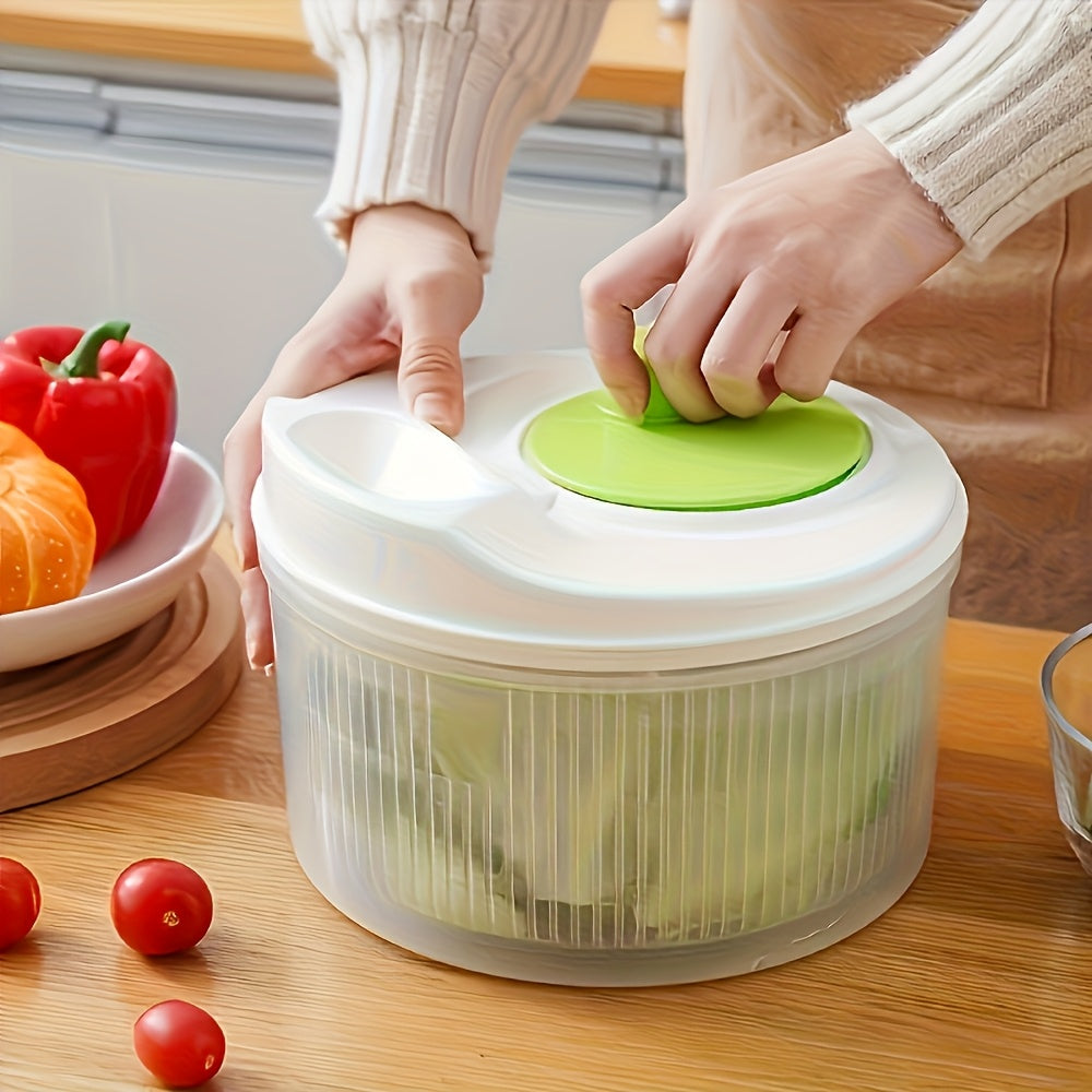 Multi-functional kitchen spinner and dryer with vegetable and fruit colander. Effortless salad prep tool made of durable PP material. White base with green accents. Ideal for healthy meal