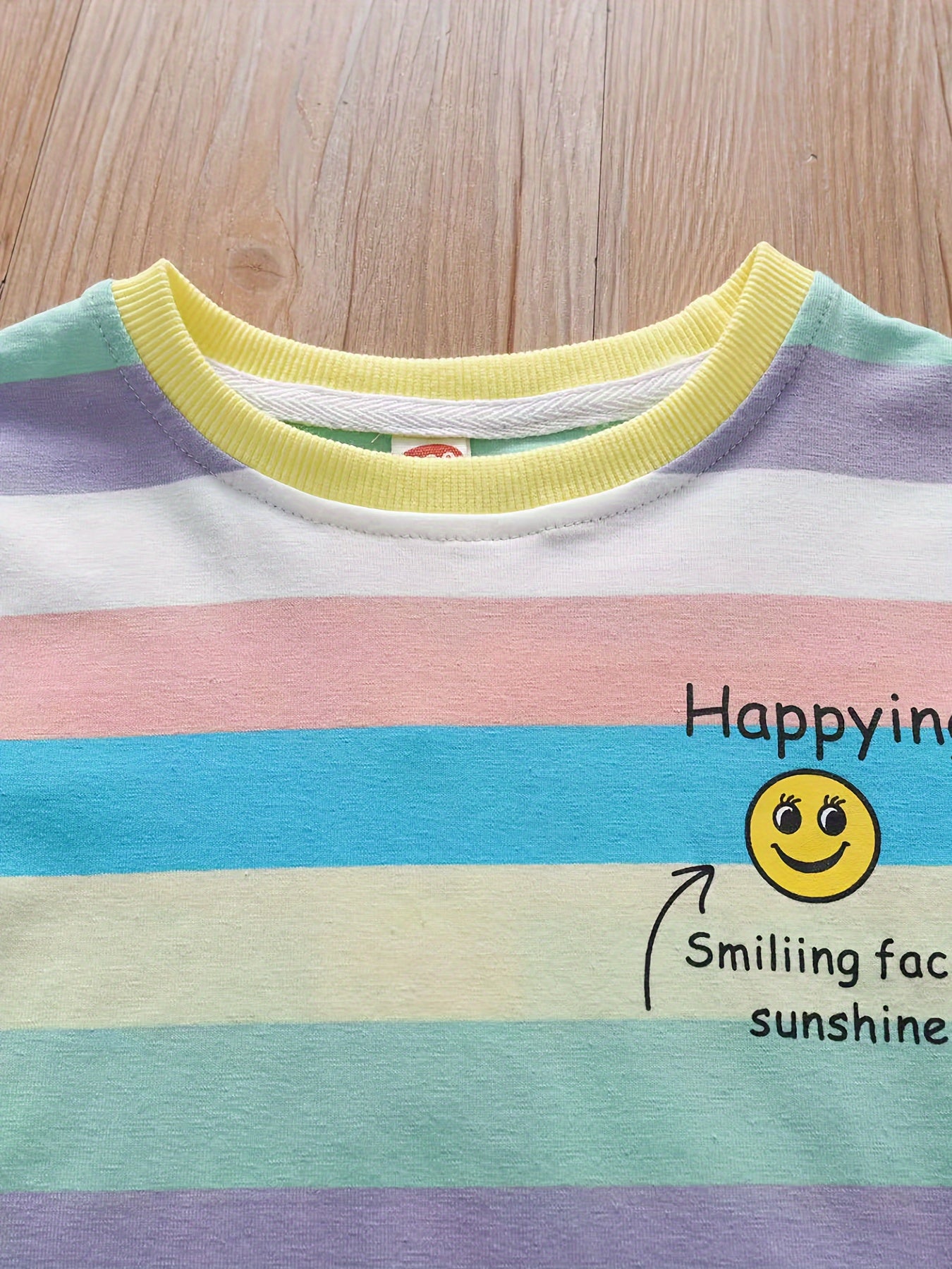 Summer fashion set for girls: Cute T-shirt with joyful face & letter print paired with striped shorts. Made of cotton blend, machine washable, ideal for outdoor activities.