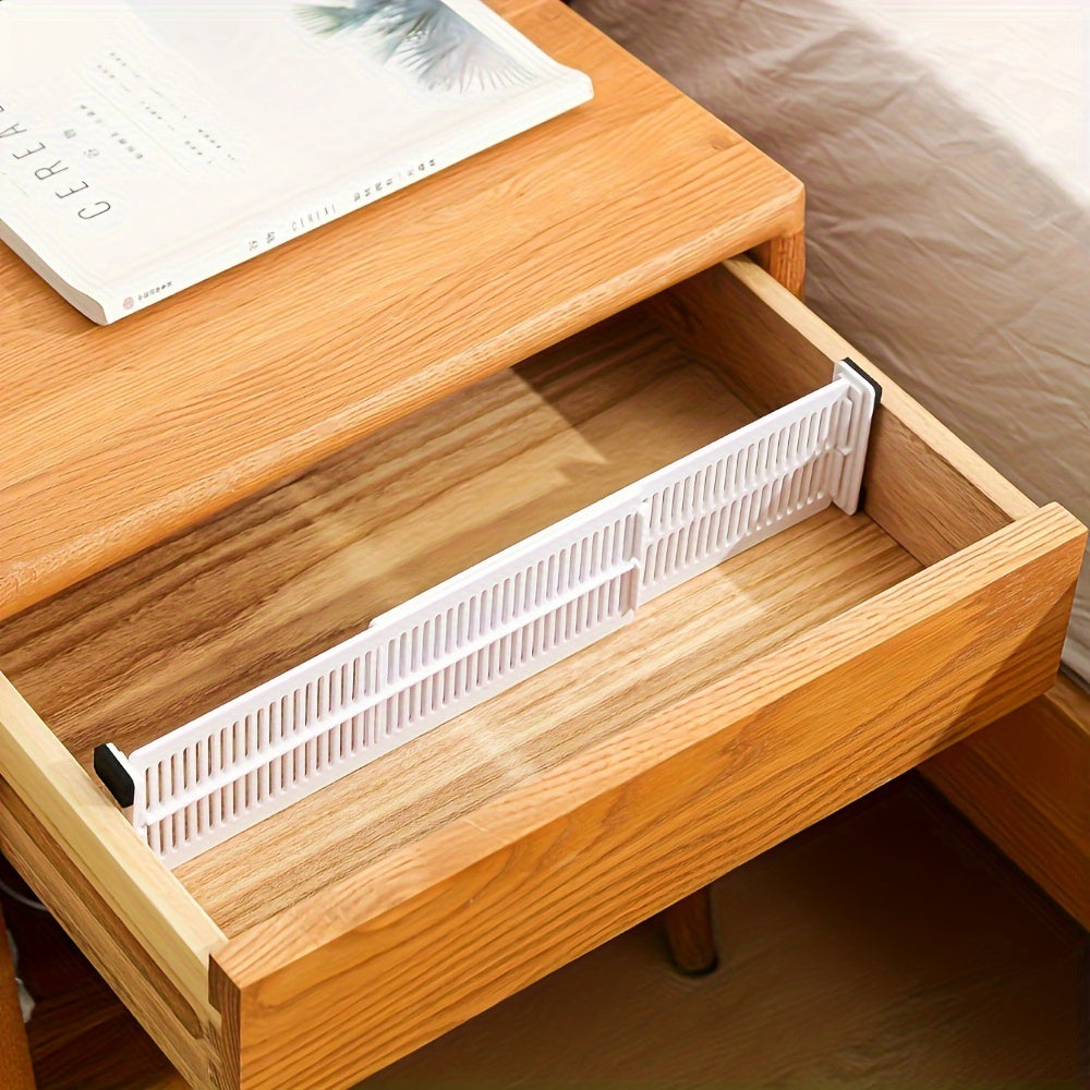 8 adjustable drawer dividers for organizing underwear and socks. Made of durable plastic with expandable grids.