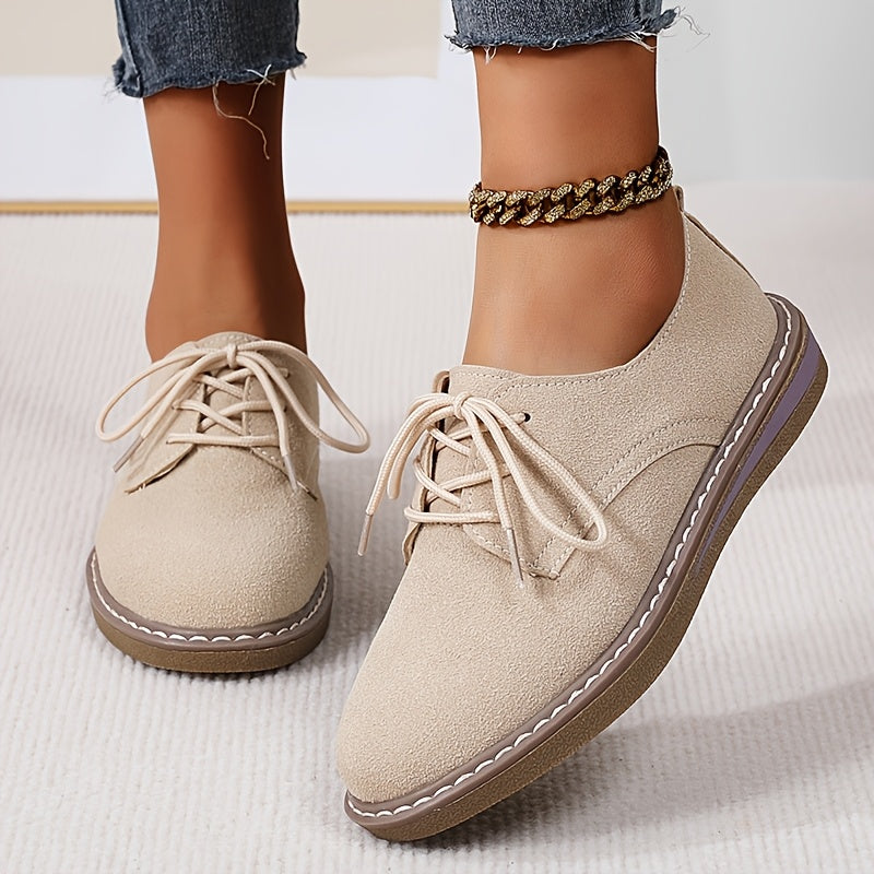 Women's lace-up flats with brogue embellishment, all-season comfort, man-made materials, TPR sole.