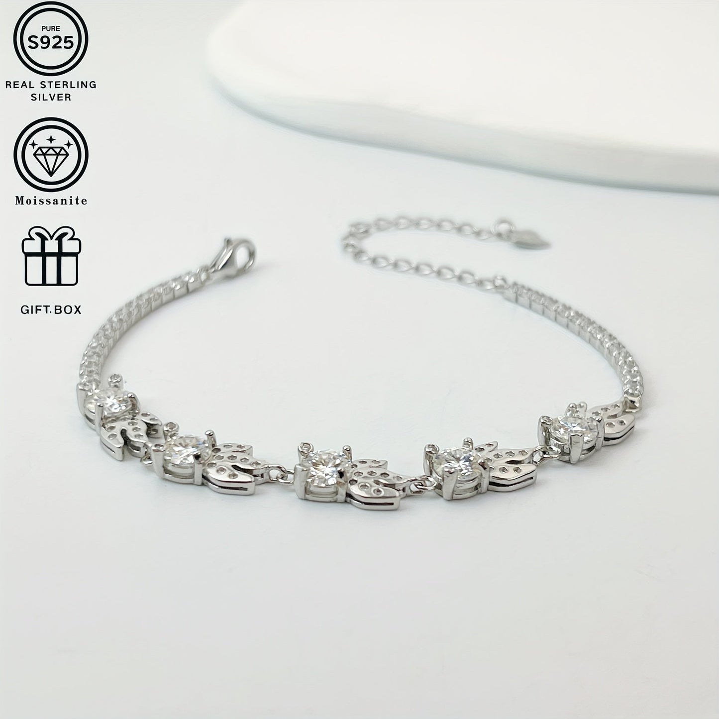 Get ready to dazzle with the exquisite Odek Elegant Sterling Silver Bracelet adorned with a stunning 0.5 Carat Goldfish Moissanite stone. This 18K Golden Plated bracelet is hypoallergenic and weighs only 5.15g, making it comfortable for all-day wear.