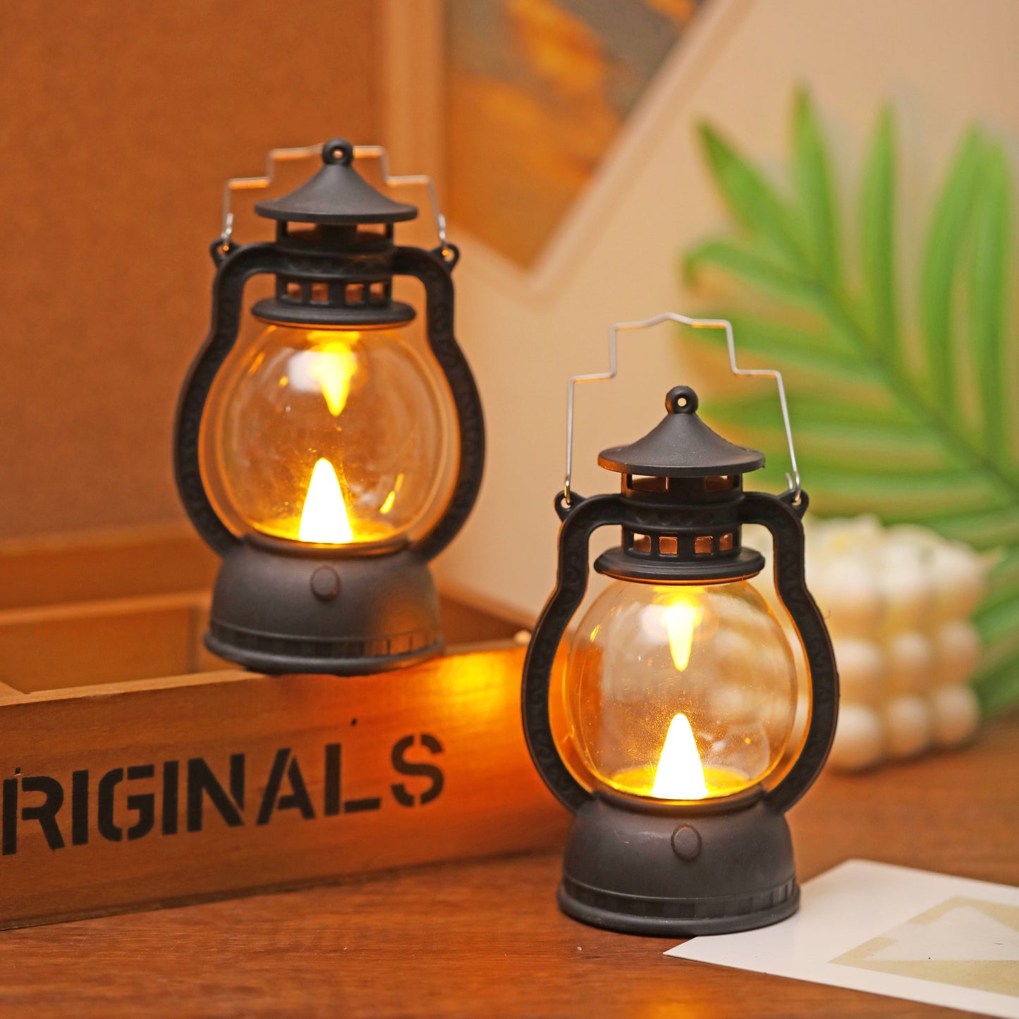 Mini LED lantern with battery included, ideal for decoration in bedroom, desk, wedding, party, or holidays. Made of plastic with faux candle light, non-rechargeable button battery included.