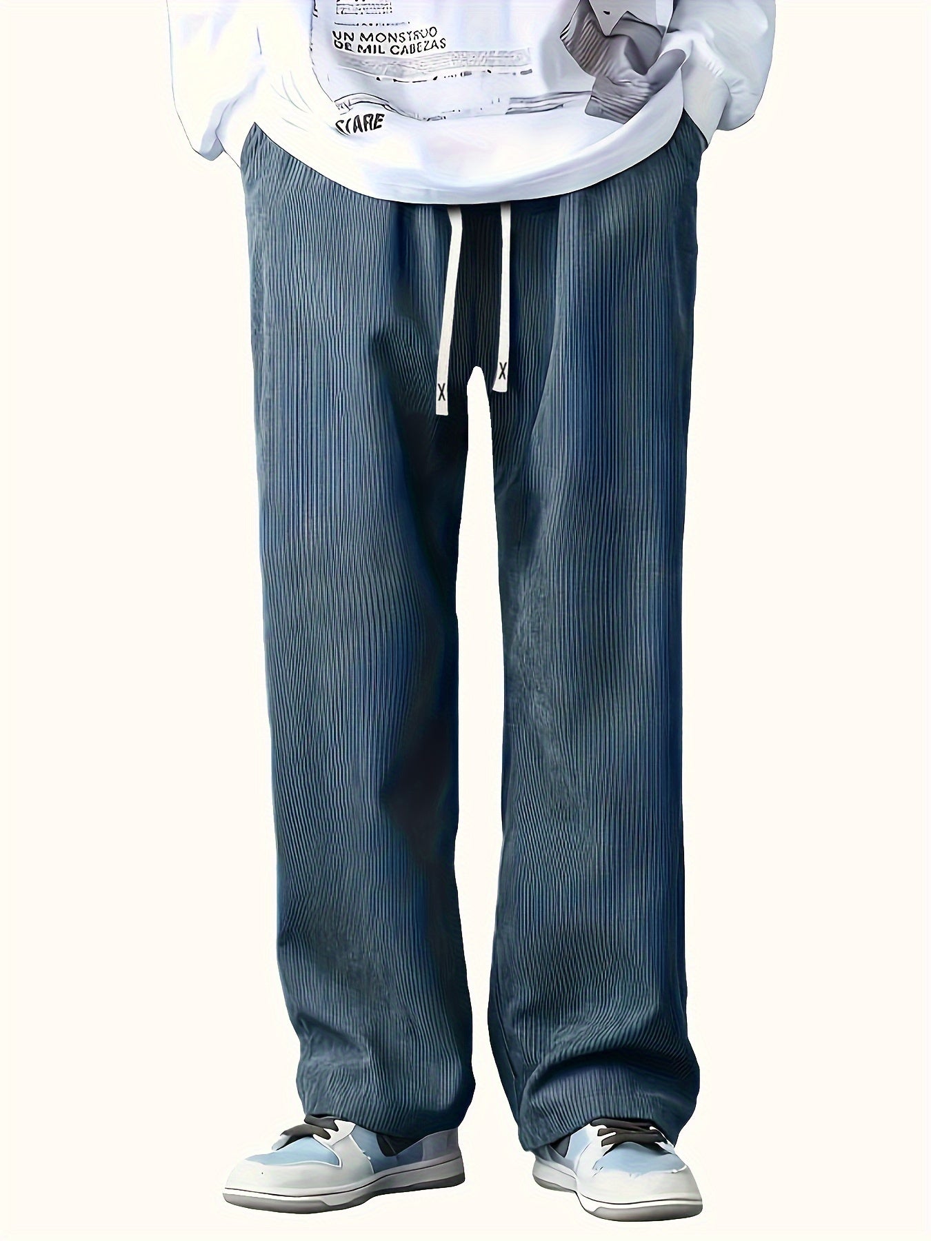 Loose straight-leg corduroy sweatpants in solid color, made of polyester blend with pockets and non-stretch fabric.