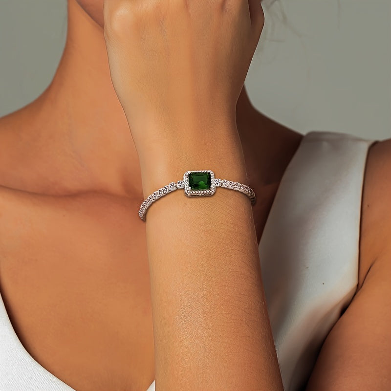 An elegant and luxurious women's bracelet featuring dazzling green Zirconia stones, crafted in adjustable 925 silver weighing just 4.3g. Perfect for daily wear, special occasions, and gifting, especially for Middle Eastern events.