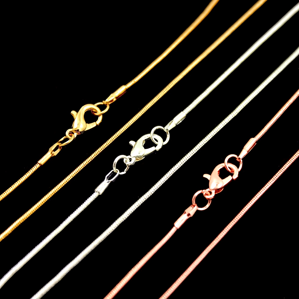 10 pieces of snake chains in Rose Gold, Gold, and Rhodium plating, ranging from 16 to 30 inches in length. Each chain comes with a lobster clasp and is perfect for creating custom jewelry pieces. Great for DIY crafting and jewelry making supplies.