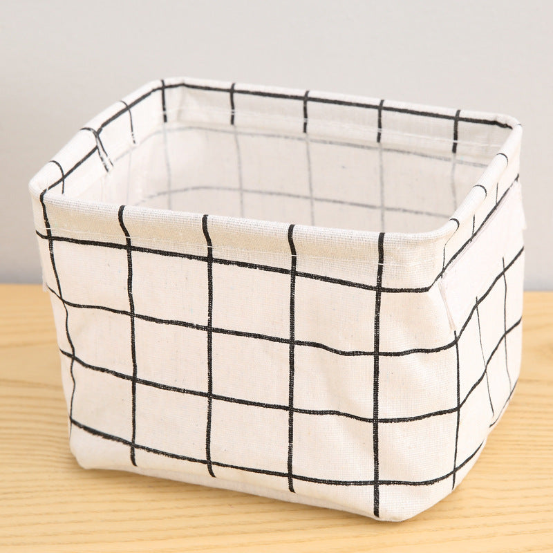 Waterproof desktop storage box made of printed cotton and linen with handle, suitable for organizing sundries.