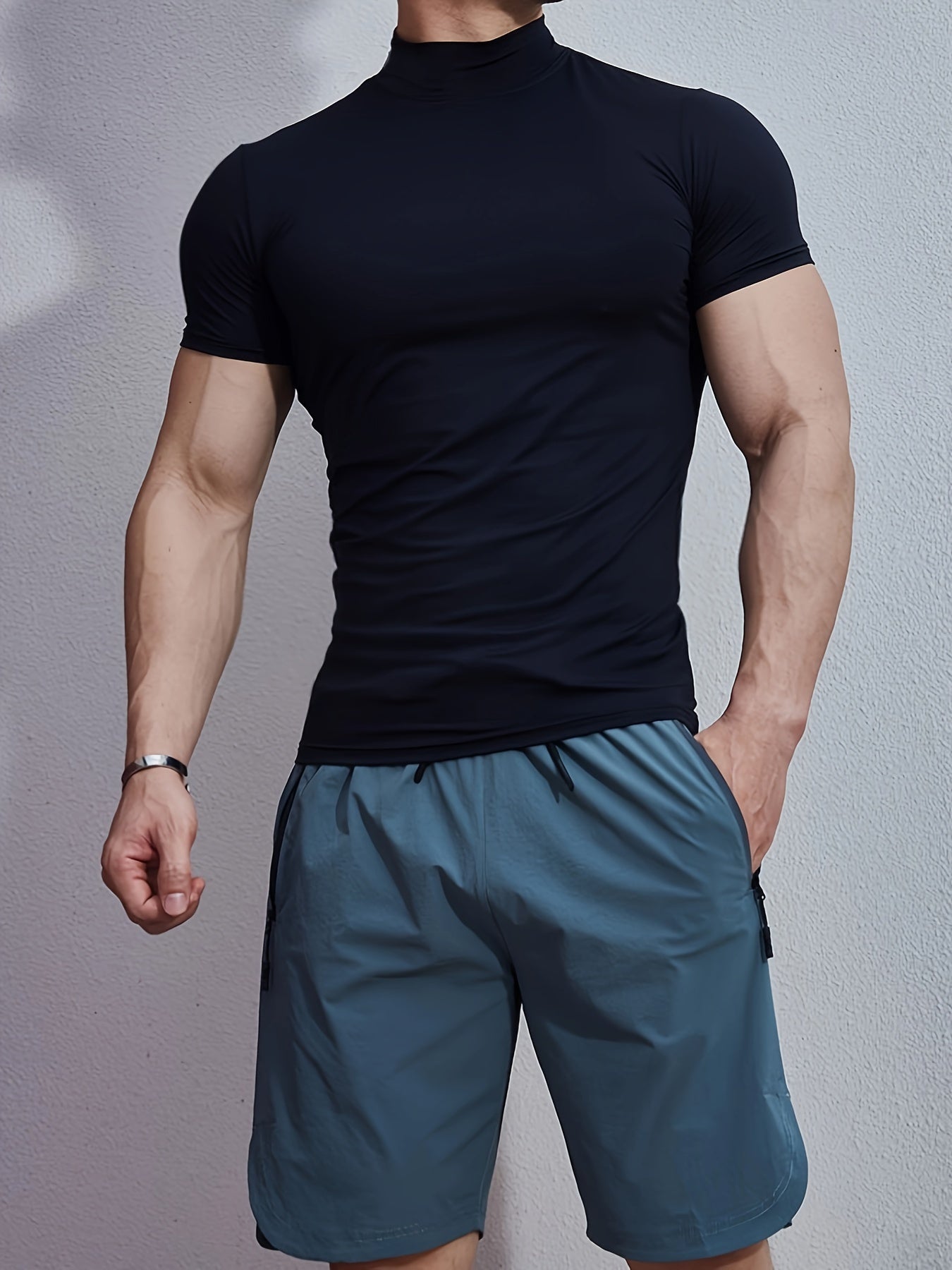 Men's athletic high neck t-shirt with quick dry, compression, and stretch fabric, ideal for training and running.