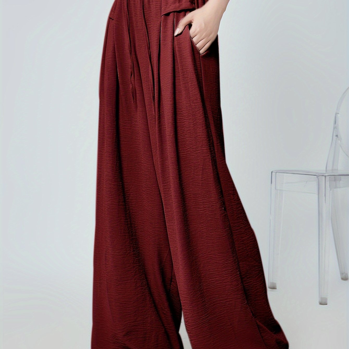 Stylish lounge bottoms with elastic drawstring, pleated detail, and wide leg fit for women's loungewear.