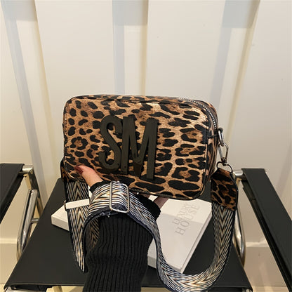 Leopard print PU crossbody bag with detachable strap in deep brown, perfect for casual or commuting outfits. Bold letter design on small shoulder bag.